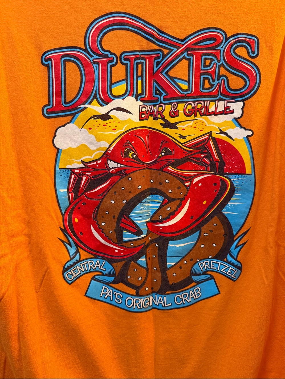 Gildan Orange Short Sleeve Tee with Red Crab & Brown Pretzel Graphic